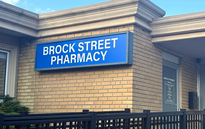 Real storefront entrance and signage of Brock Street Pharmacy at 619 Brock St S in Whitby, Ontario